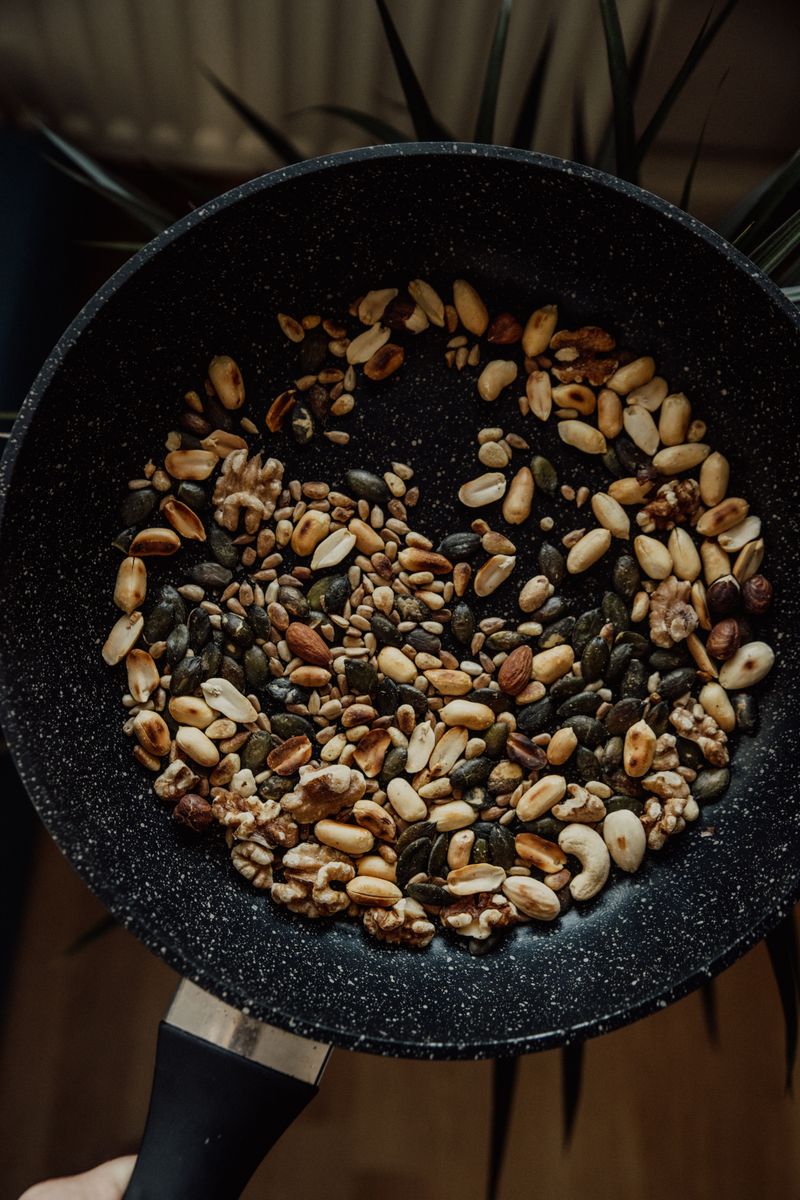 Almonds, cashews and pumpkin seeds in a roasting pan